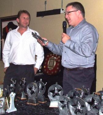 *Sevenths bowling award winner John Brelis (left) receives his award from Club Secretary Peter Golding.